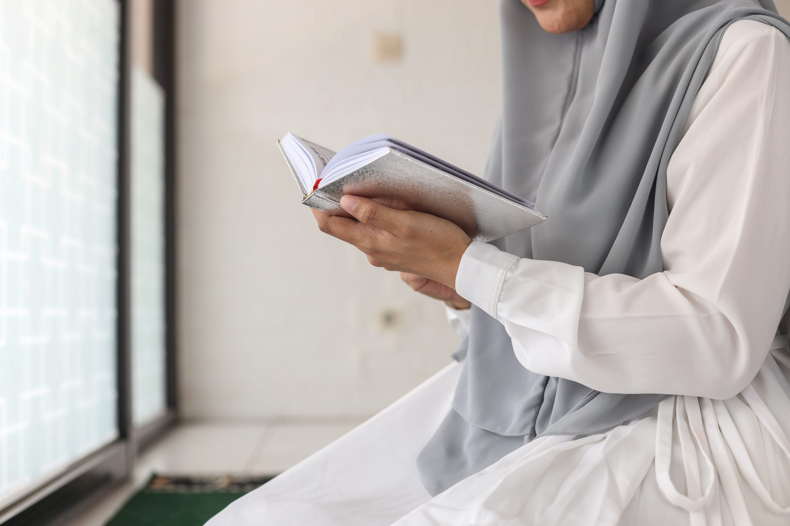 close-up-of-muslim-woman-reading-koran-2022-12-15-01-28-25-utc